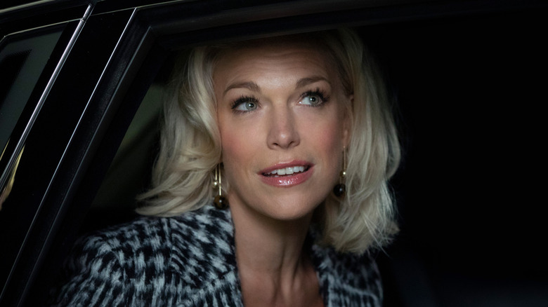 Rebecca Welton looks out the open window of a car