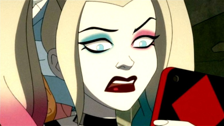 Harley Quinn looking at her phone