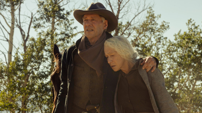 Jacob and Cara Dutton standing in woods