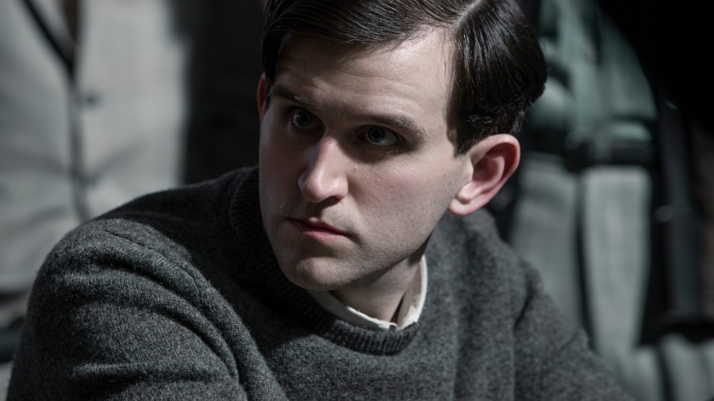 Harry Melling glaring