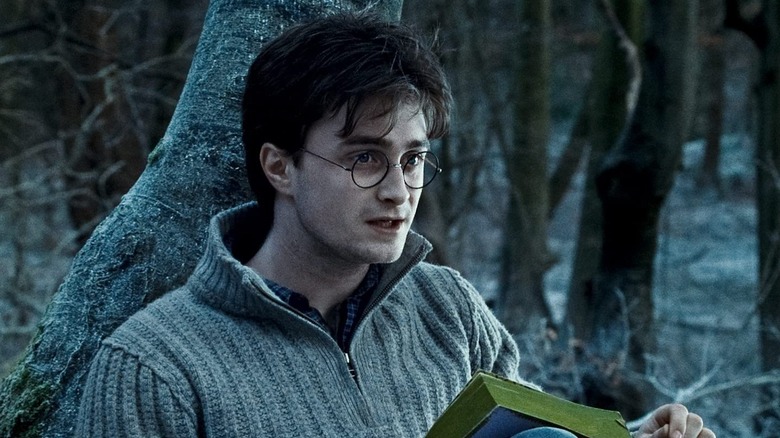 Harry leaning against tree gasping