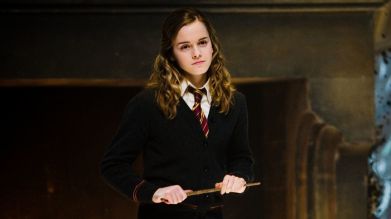 Hermione standing holding wand