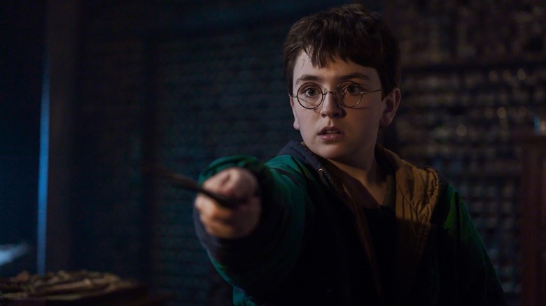 Harry pointing a wand apprehensively in Harry Potter and the Philosopher's Stone (2026)