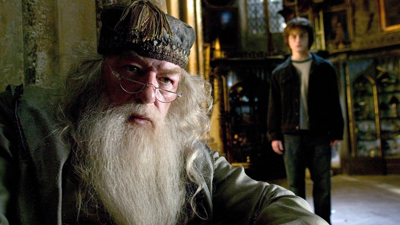 Dumbledore Harry behind him