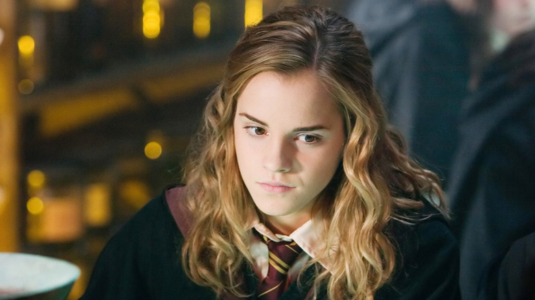 Hermione frowning looking down