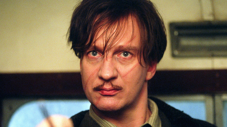 Remus Lupin points his wand