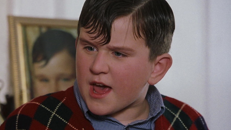 Dudley wearing a red sweater