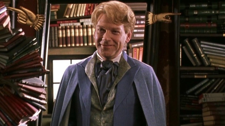 Gilderoy Lockhart smiling purple suit