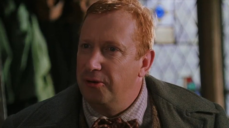 Arthur Weasley speaking to Harry
