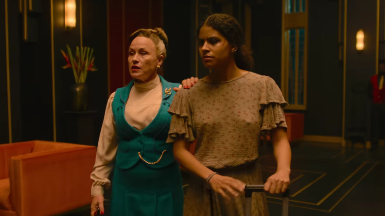 Lily Woodhouse guiding Asia Reaves through a lobby in They Will Kill You