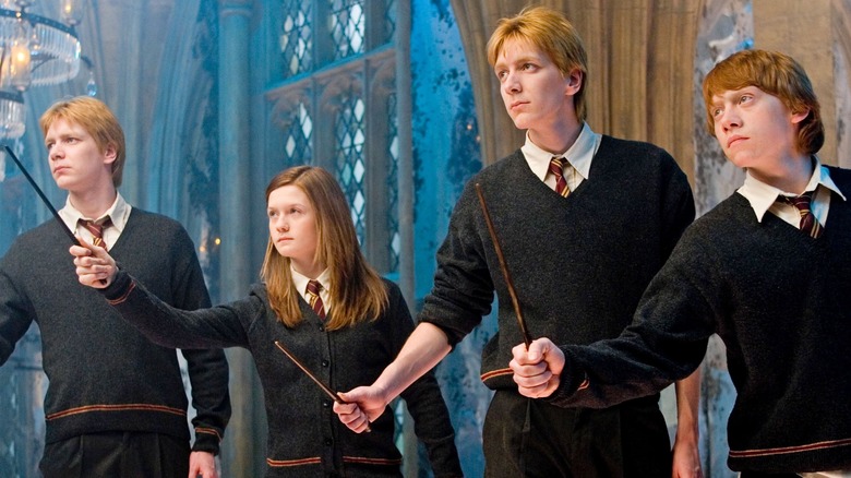 Fred Ginny George Ron Weasley holding wands