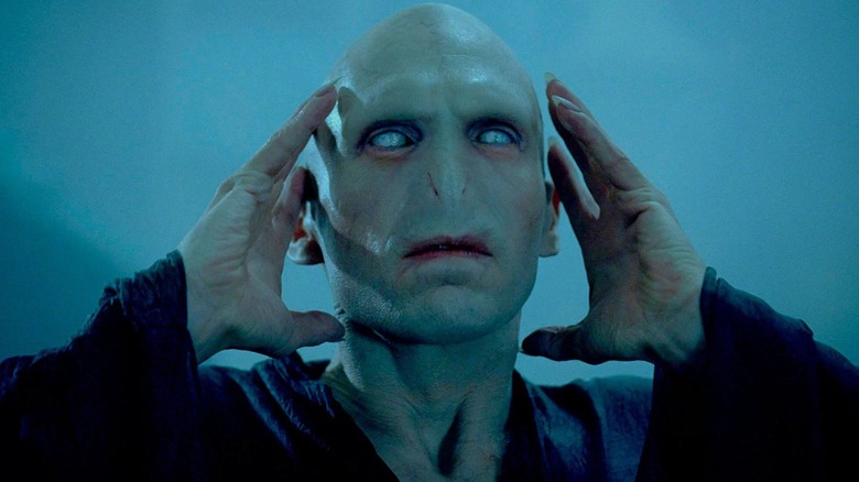 Voldemort touching head eyes blue