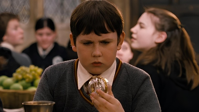 Neville Longbottom holding his Remembrall