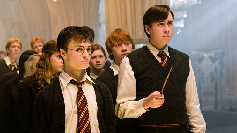 Harry Potter and Neville Longbottom looking attentive in Harry Potter and the Order of the Phoenix