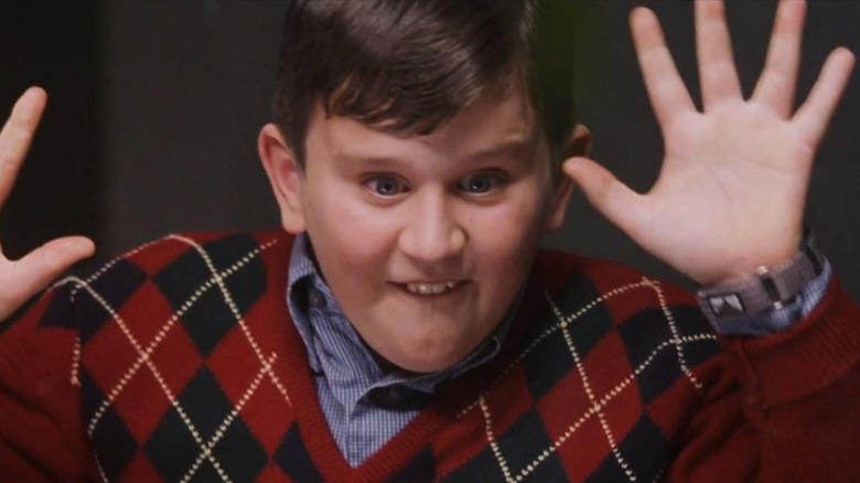 Dudley Dursley with hands on glass