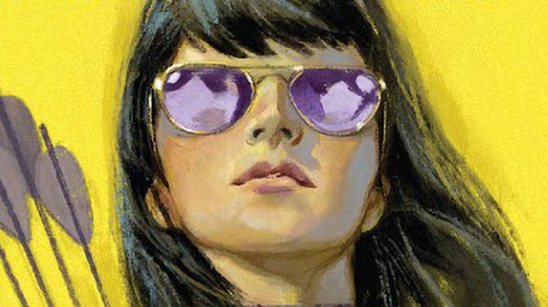 Kate Bishop wearing purple sunglasses