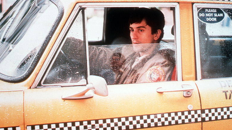 Travis Bickle sitting in his taxi in 
