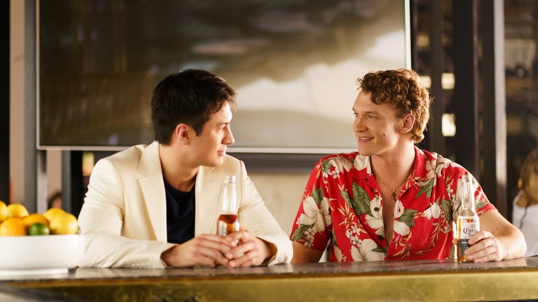 Shane and Ilya drinking beers at a bar on Heated Rivalry