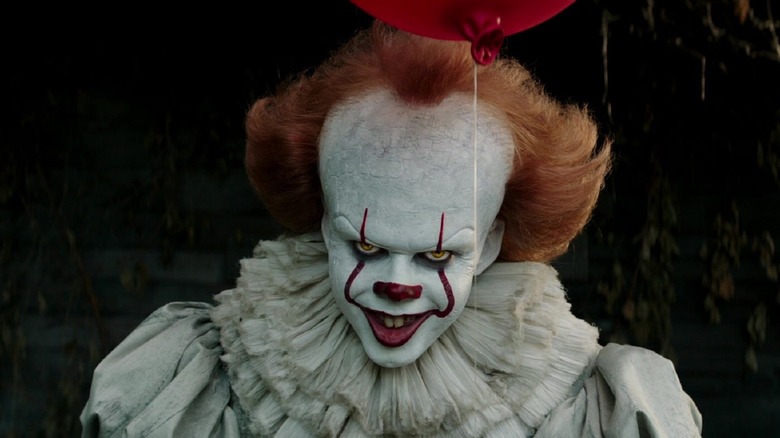 Pennywise holding a balloon