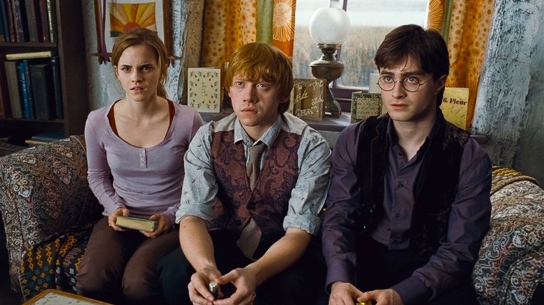 Ron, Hermione, and Harry looking disturbed