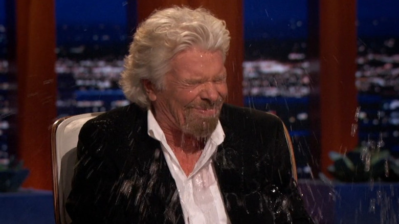 Richard Branson getting water thrown on him by Mark Cuban