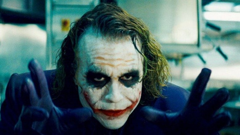 Joker holding hands up