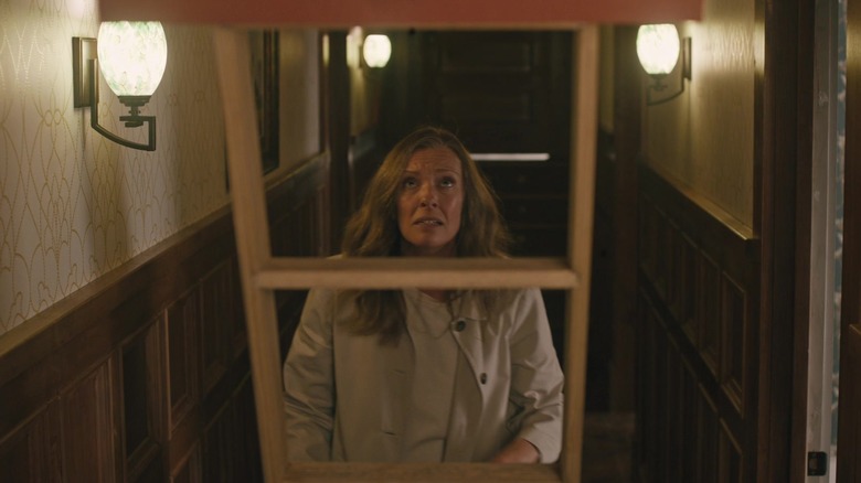 Annie going into attic