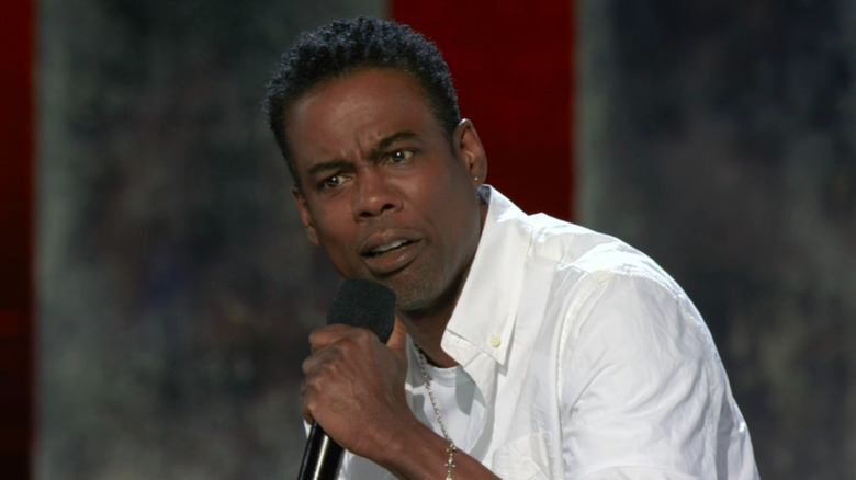 Chris Rock frowning microphone