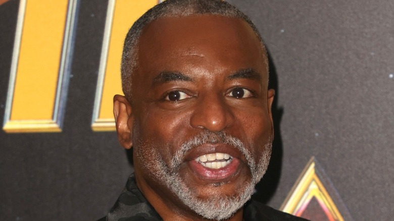 LeVar Burton smiles at a red carpet event 