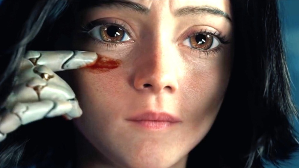 Alita in Alita: Battle Angel smearing something on her face