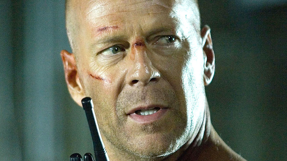 John McClane talking on a walkie-talkie