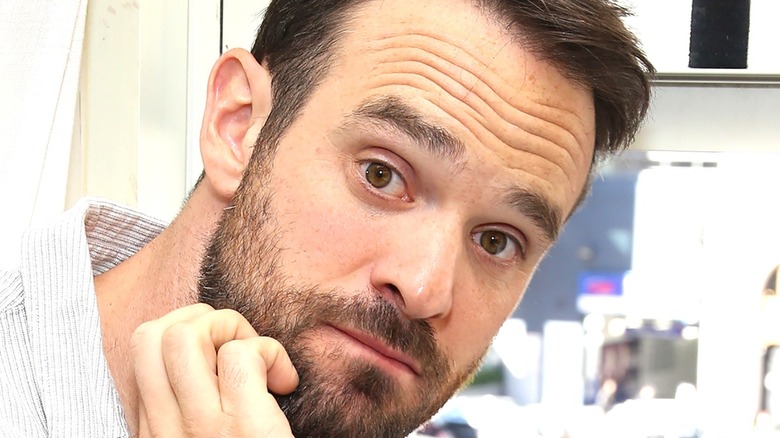 Actor Charlie Cox with hand on chin