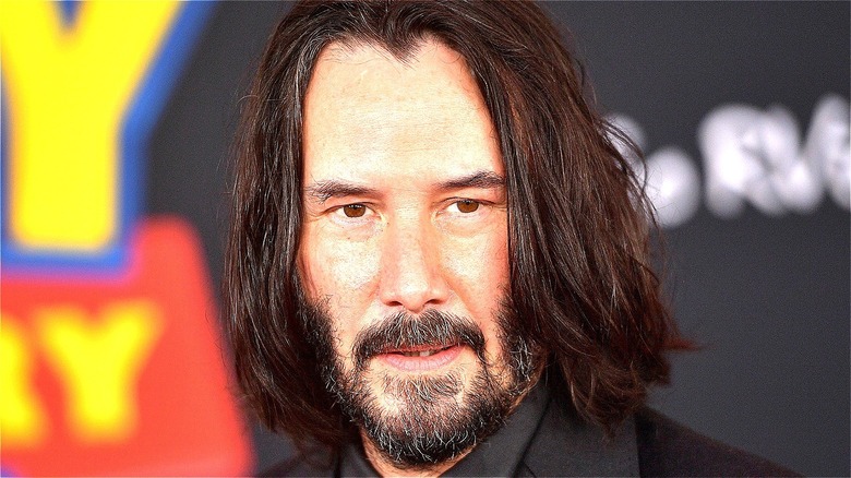 Keanu Reeves smirking