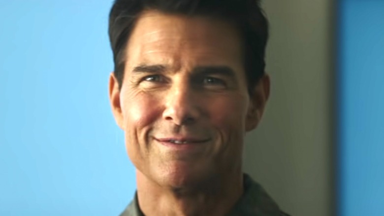 Tom Cruise grinning as Maverick