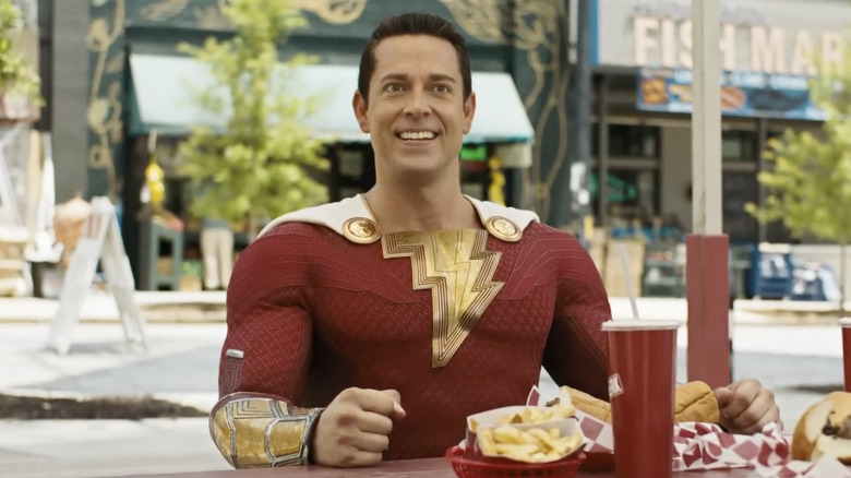 Shazam! wearing costume eating fast food