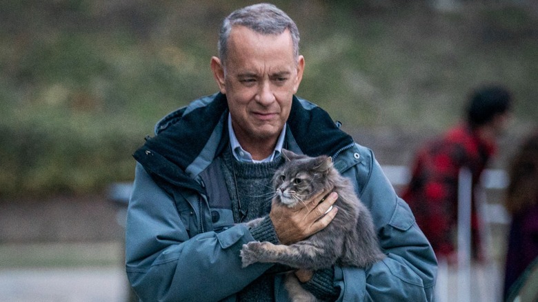 Otto holding a cat