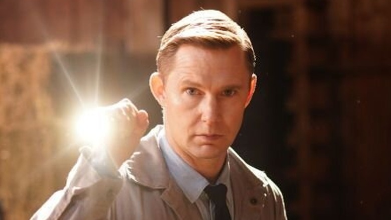 Ron Pergman stares vigilantly
