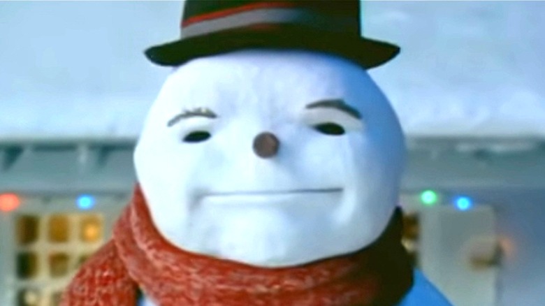 Snowman looks at camera