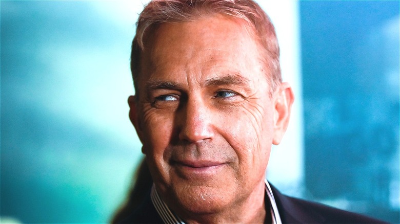 Kevin Costner smiling and looking left