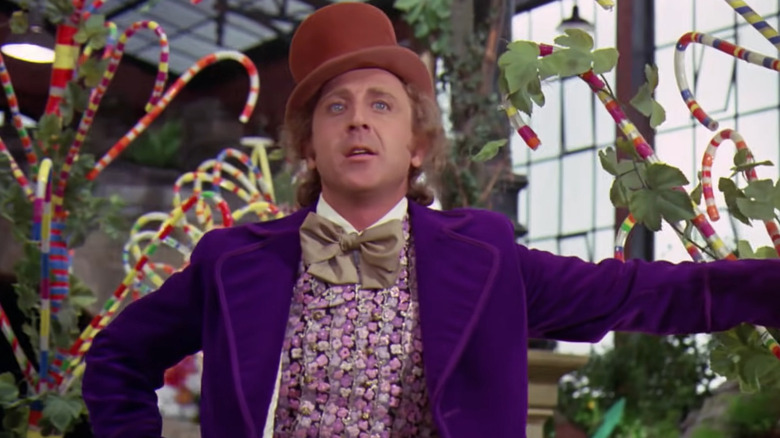 Willy Wonka leaning on tree