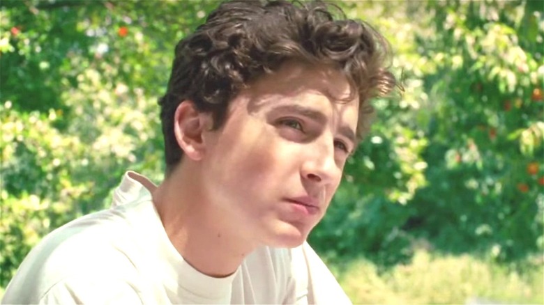 Timothée Chalamet staring pensively