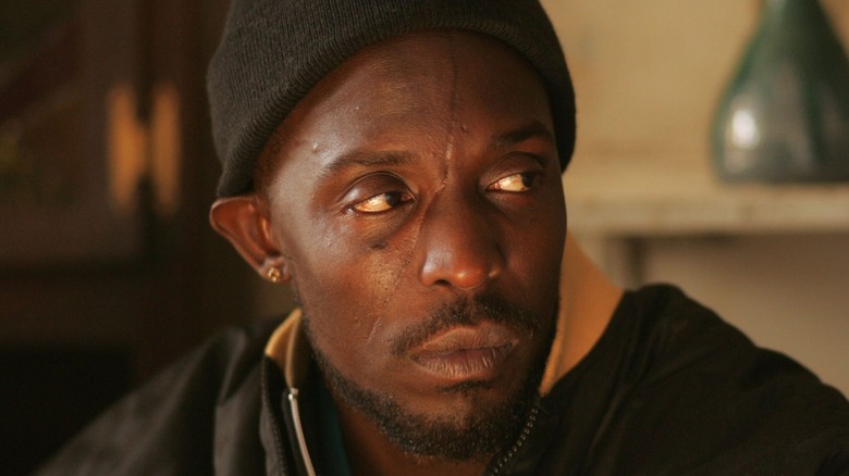 Omar Little wearing black beanie