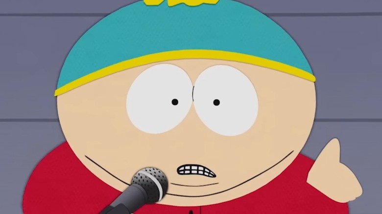 Cartman speaking at a podium
