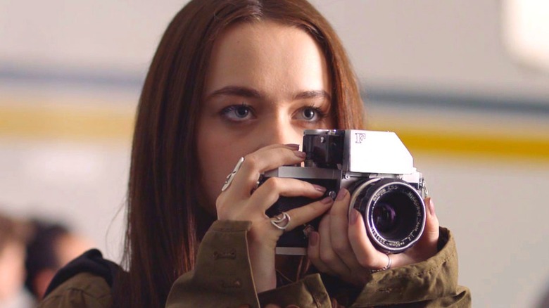 Lucy Loken holds a camera