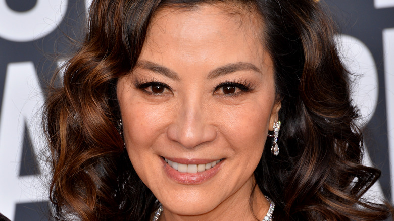 Michelle Yeoh wearing diamond earrings