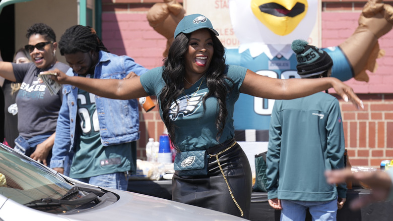 Abbott Principal smiles in Eagles gear