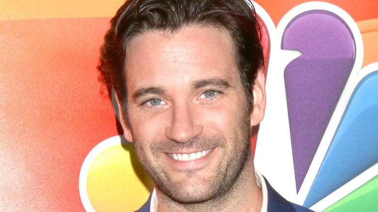 Actor Colin Donnell smiling for photographers