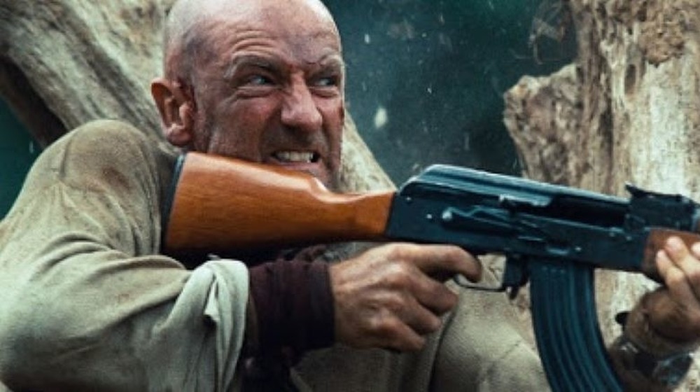 Rambo Lewis shooting assault rifle
