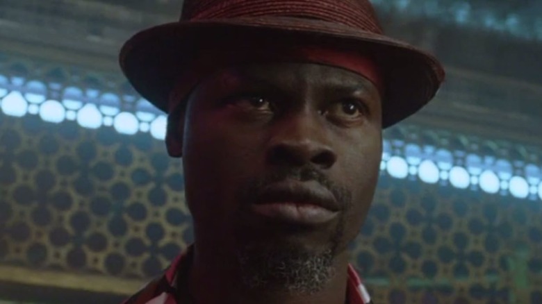 Constantine's Papa Midnite in a trilby hat