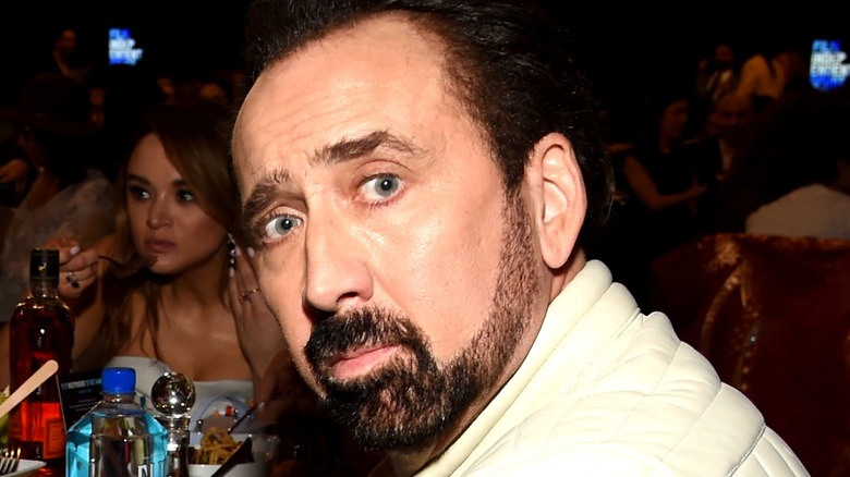 Nicolas Cage looking over his shoulder